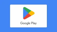 Ilustrasi resmi kartu voucher Google Play: kartu putih dengan logo segitiga Google Play berwarna hijau, biru, merah, dan kuning serta tulisan Google Play, di atas latar biru